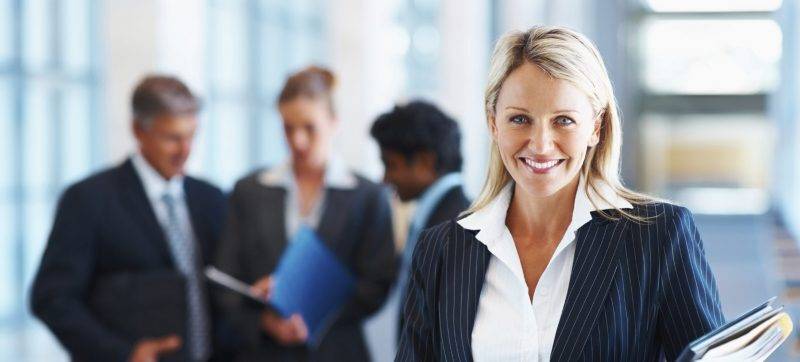 business woman with colleagues in discussion at the background