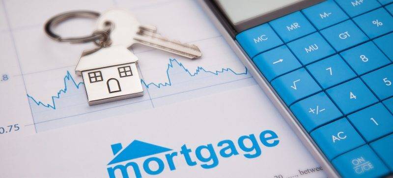 Mortgage application form with house key